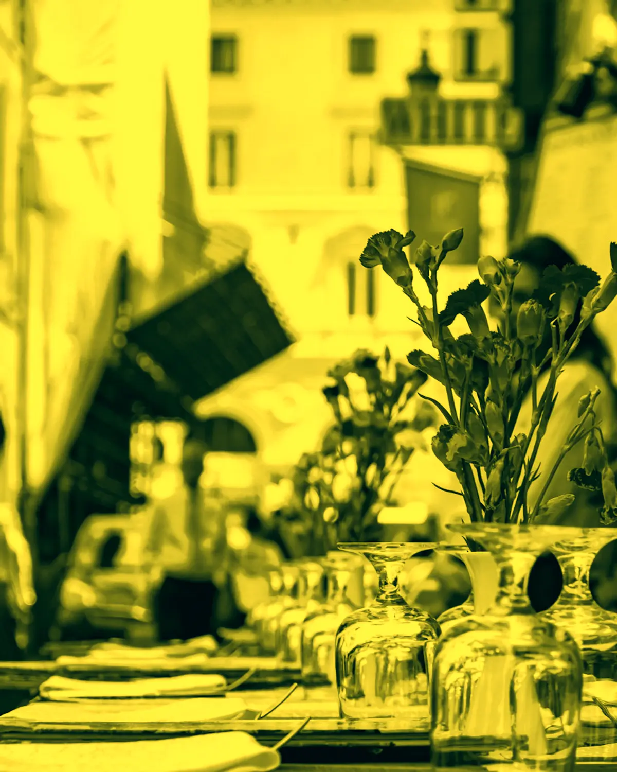 Waiter at a restaurant terrace, yellow duotone
